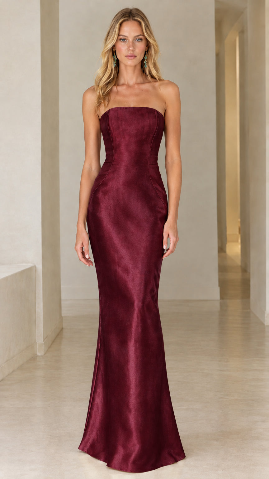 Front view of burgundy strapless satin evening gown on model