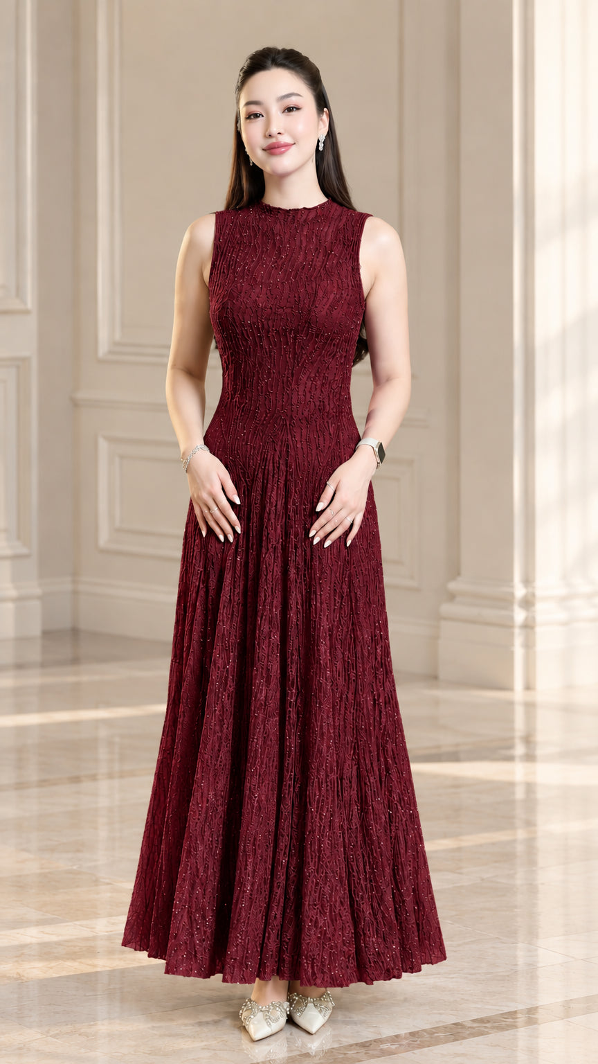 Front view of model wearing burgundy sleeveless textured plissé maxi dress