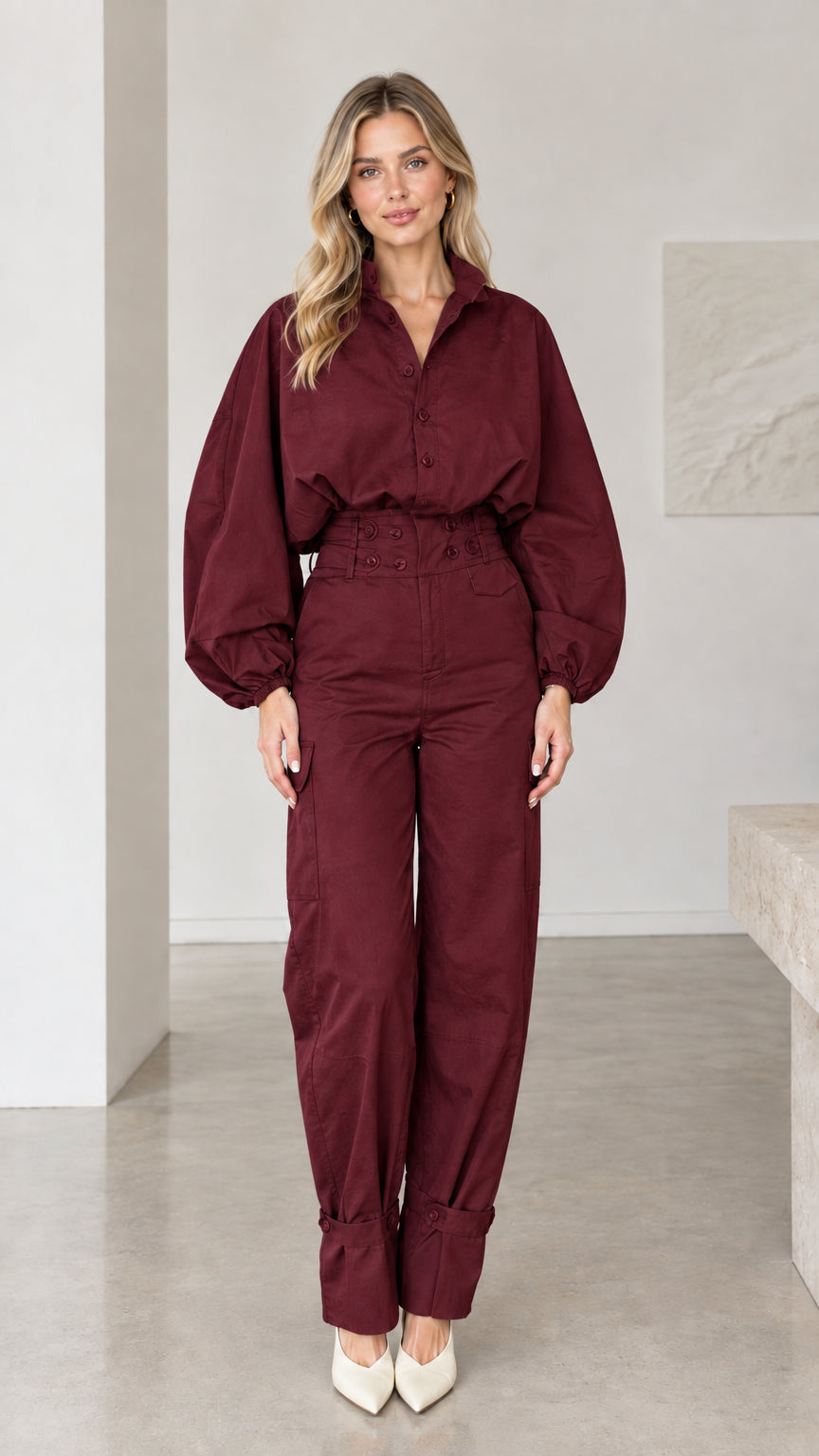 Front view of woman wearing burgundy wine red collared cargo jumpsuit