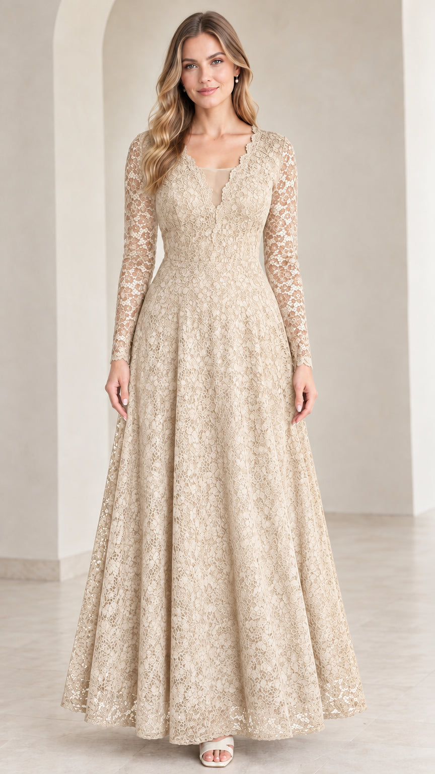 Front view of model wearing Champagne gold long sleeve lace maxi evening gown
