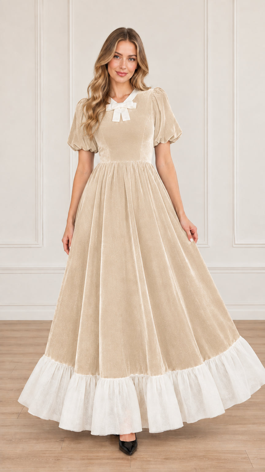 Front view of champagne beige velvet maxi dress with contrast white bow collar and hem