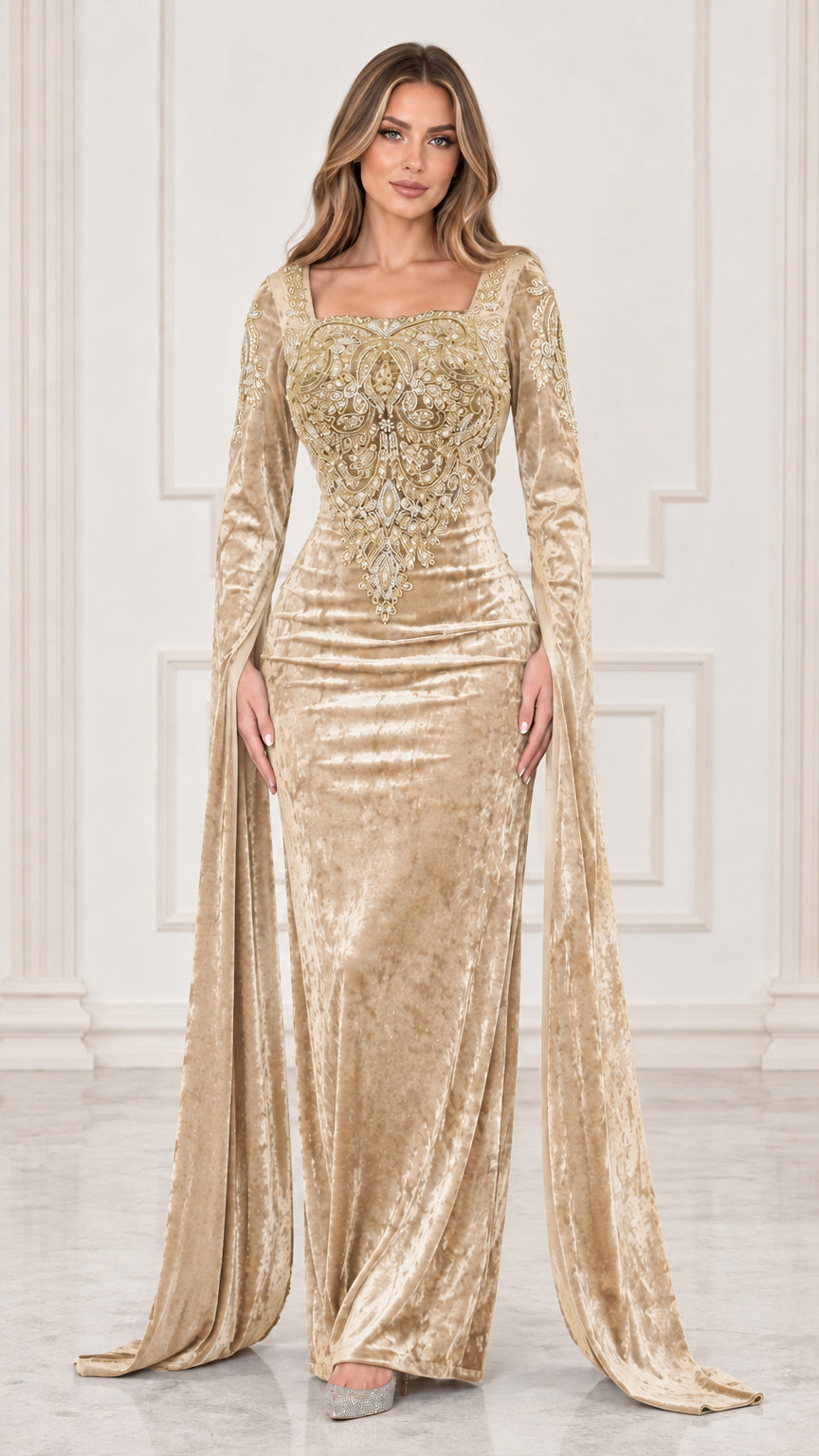 Front view of champagne gold velvet evening gown with intricate embroidery and flowing sleeves