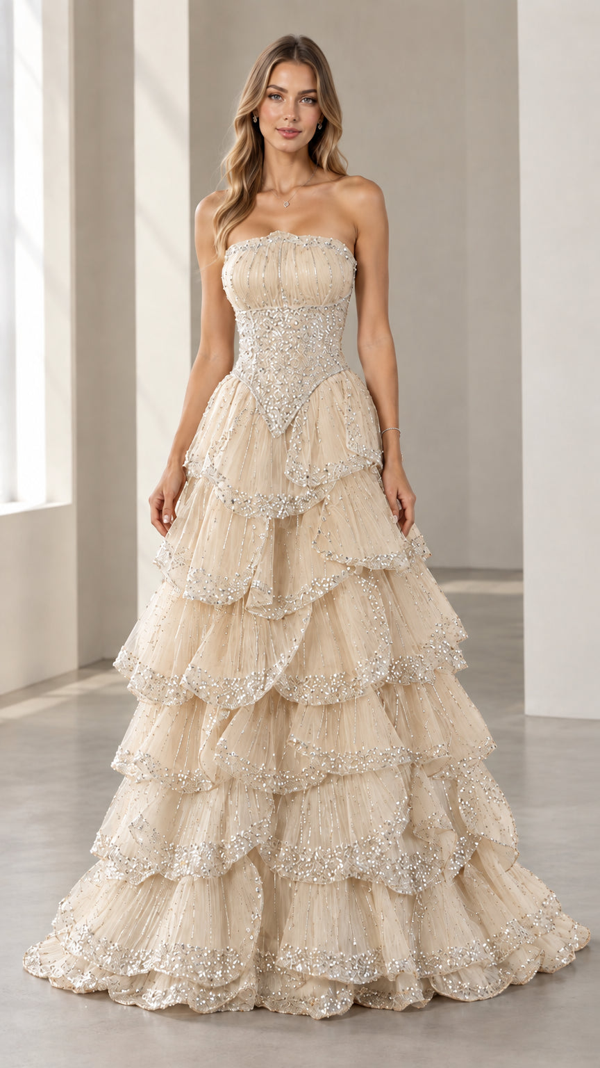 Full-length front view of the strapless beaded tiered evening gown in Champagne