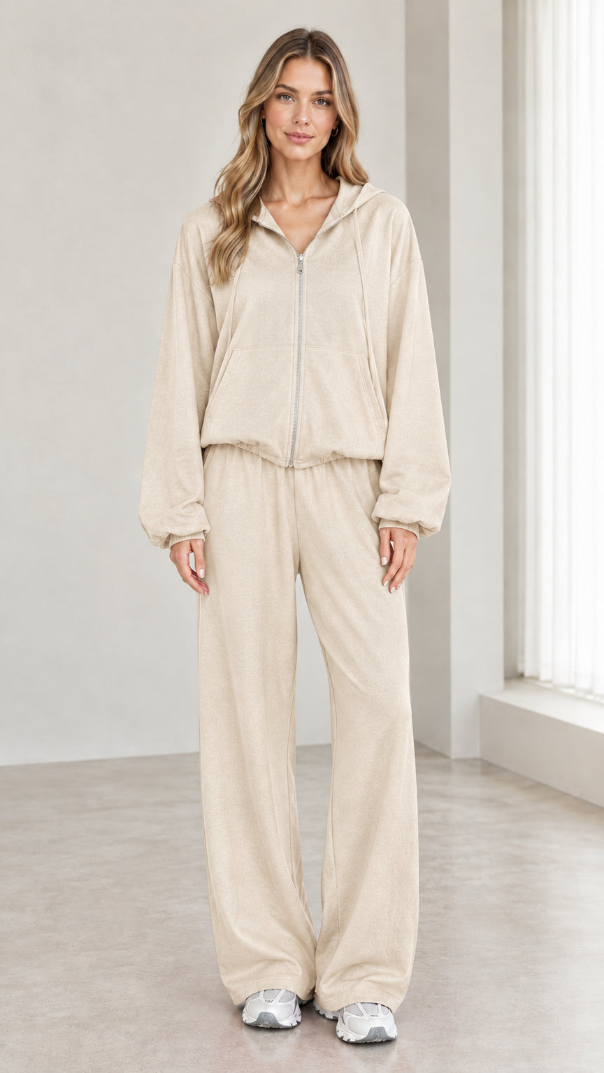 Woman wearing beige 2-piece zip-up hoodie and wide-leg pants tracksuit set