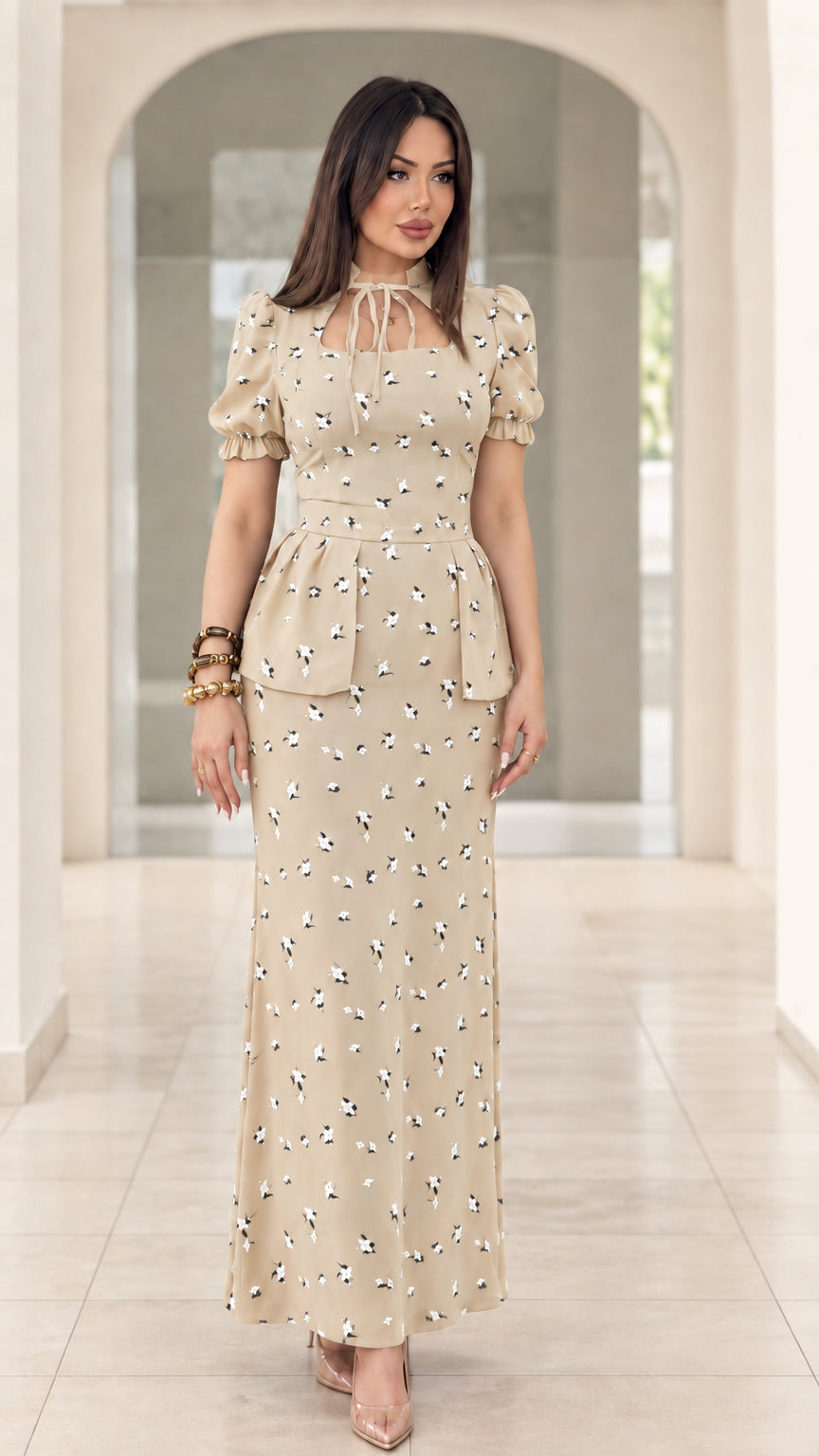Model wearing beige floral print peplum puff sleeve maxi dress
