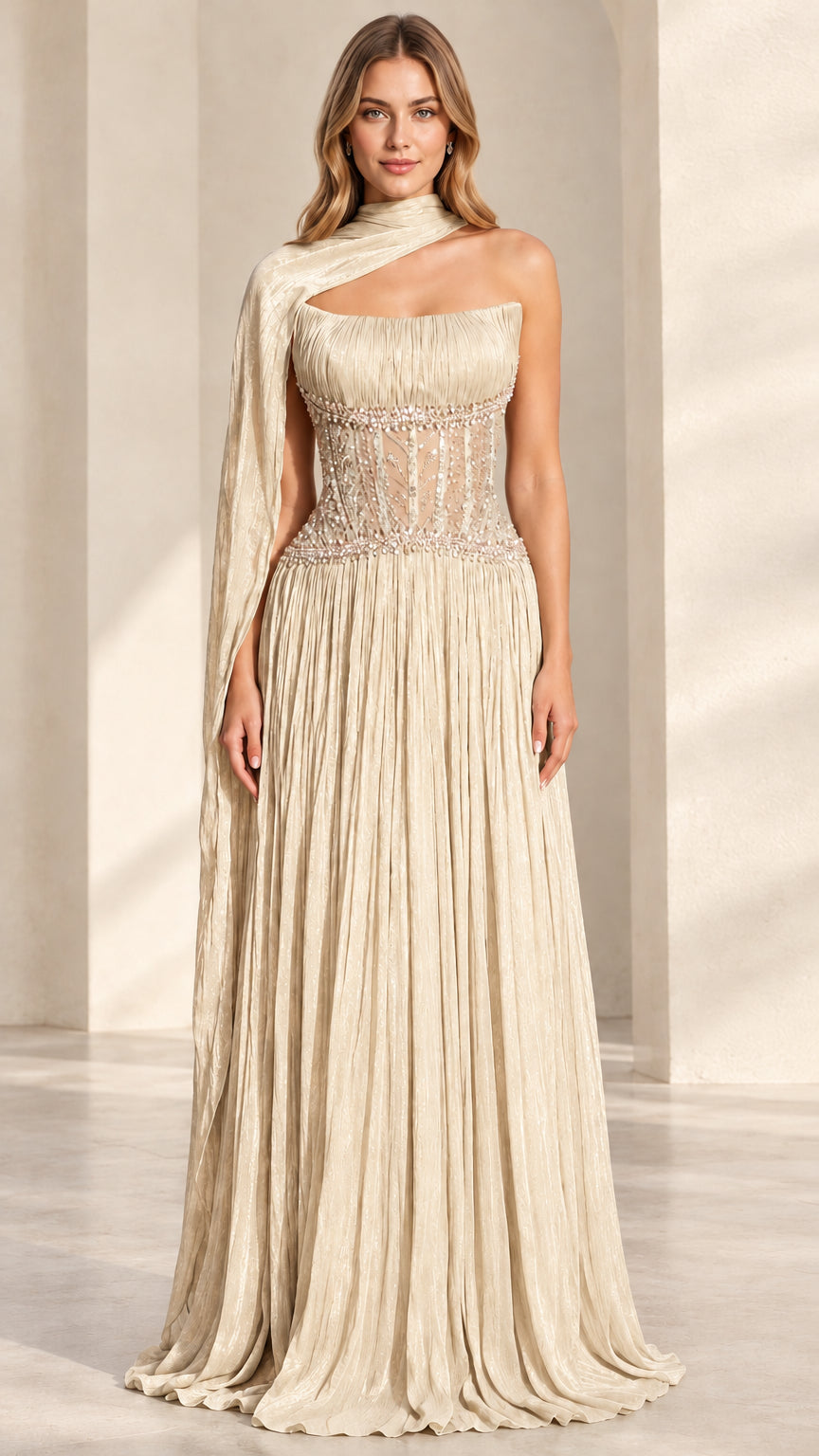 Champagne cream pleated formal maxi gown with sheer beaded corset and shoulder cape