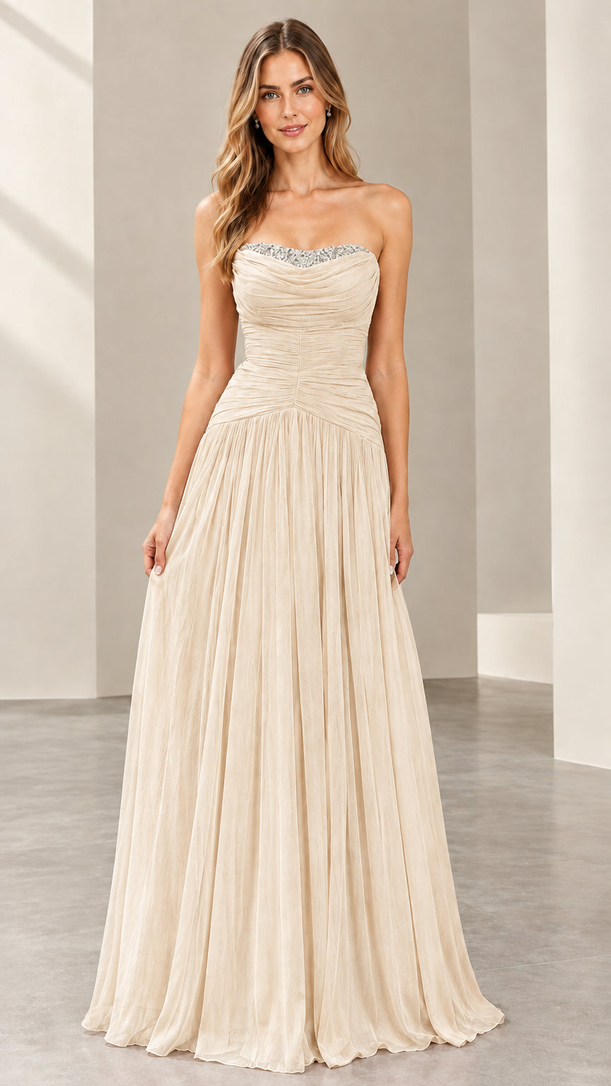 Front view of woman wearing the strapless ruched evening gown in champagne cream