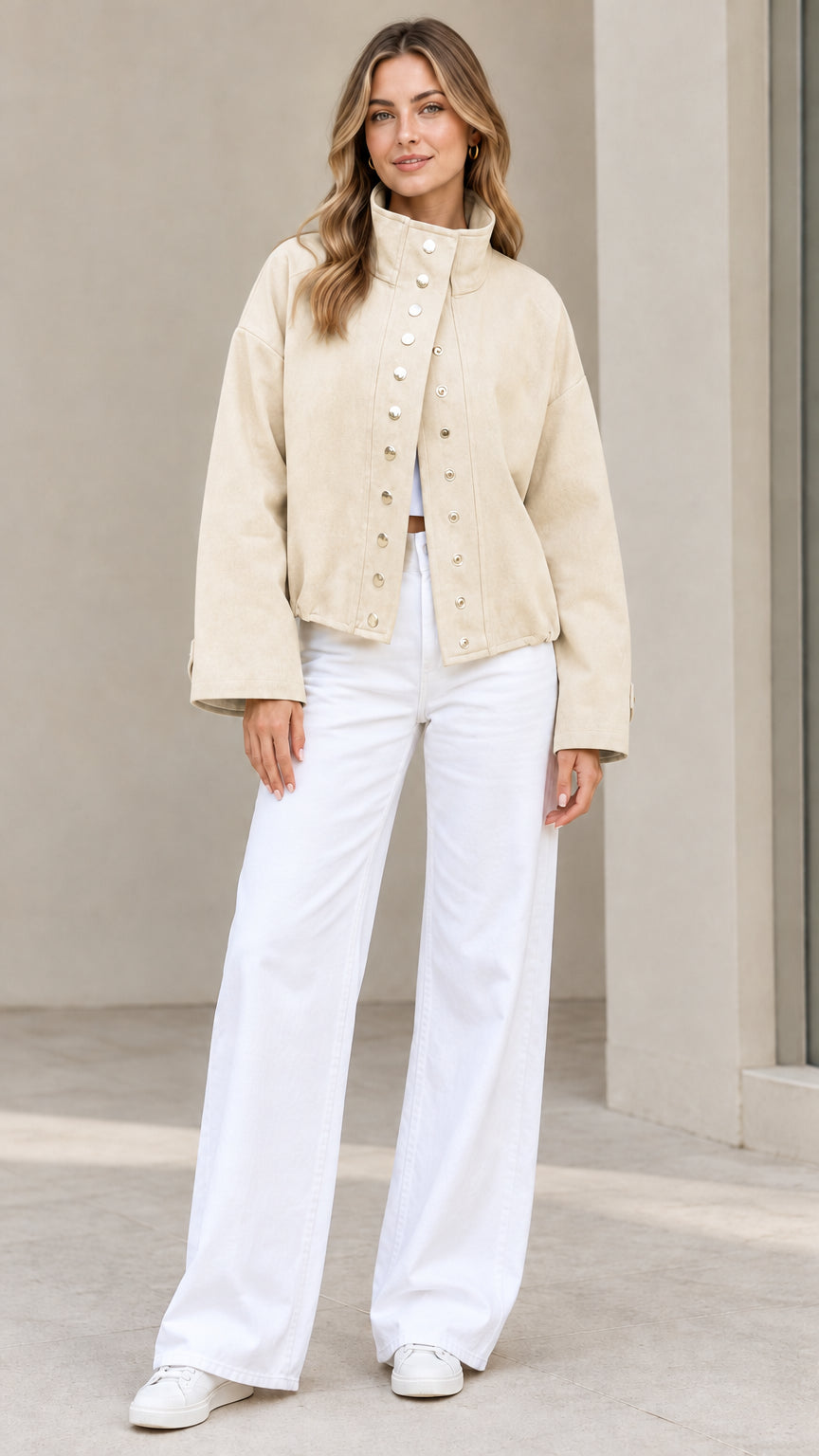 Full-length view of woman wearing Cream beige casual snap jacket with white pants