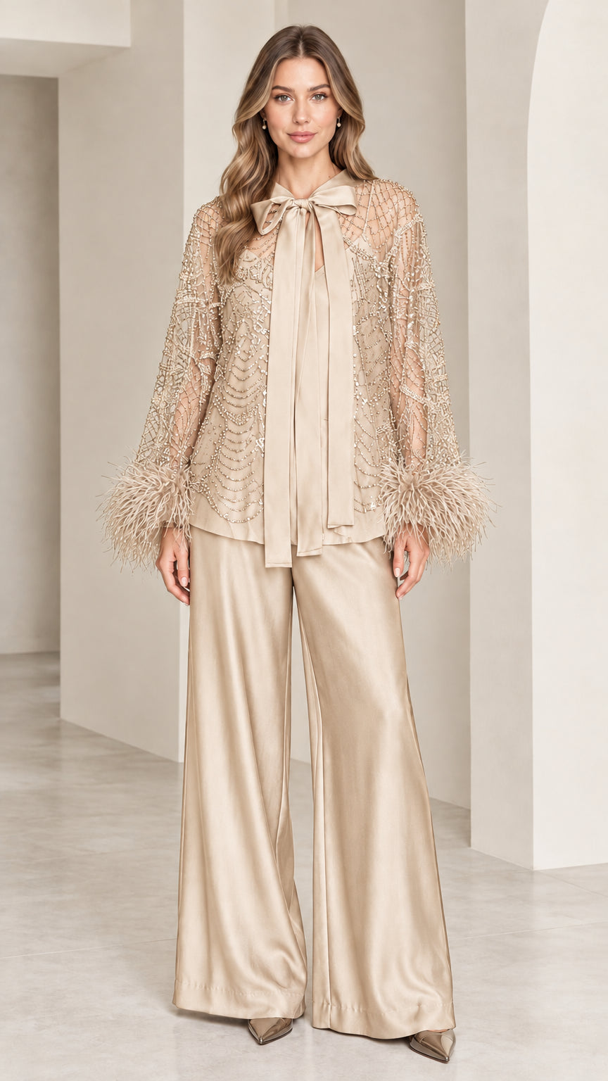 Champagne gold sequined top with feather cuffs and wide-leg satin pants