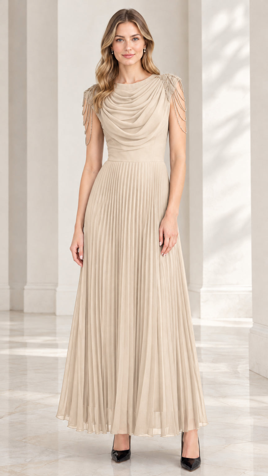 Model wearing champagne beige pleated maxi dress with beaded cap sleeves