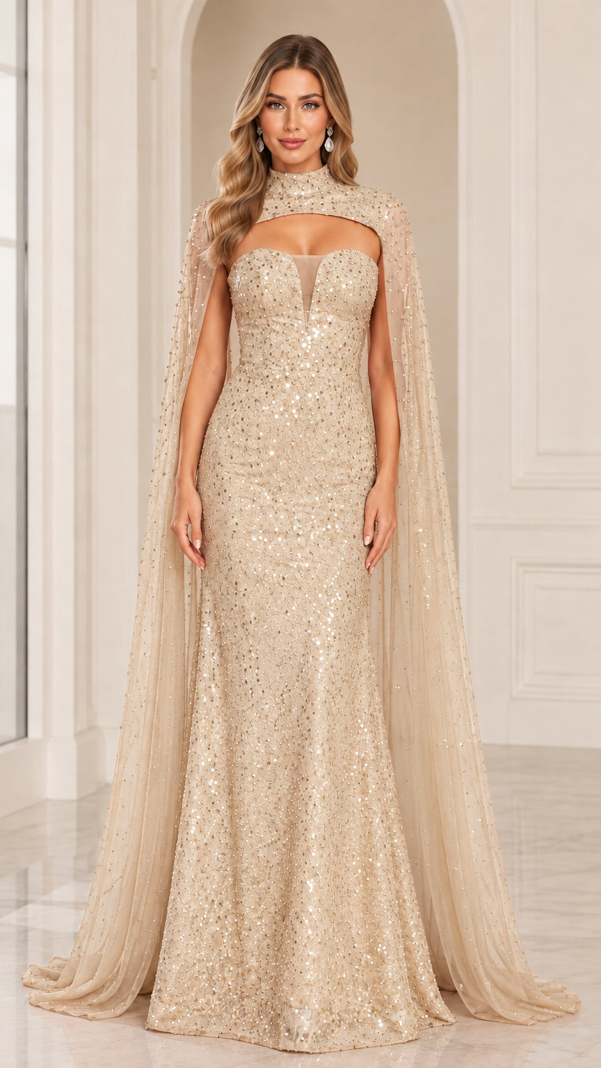 Front view of woman wearing champagne gold sequin mermaid evening gown with cape