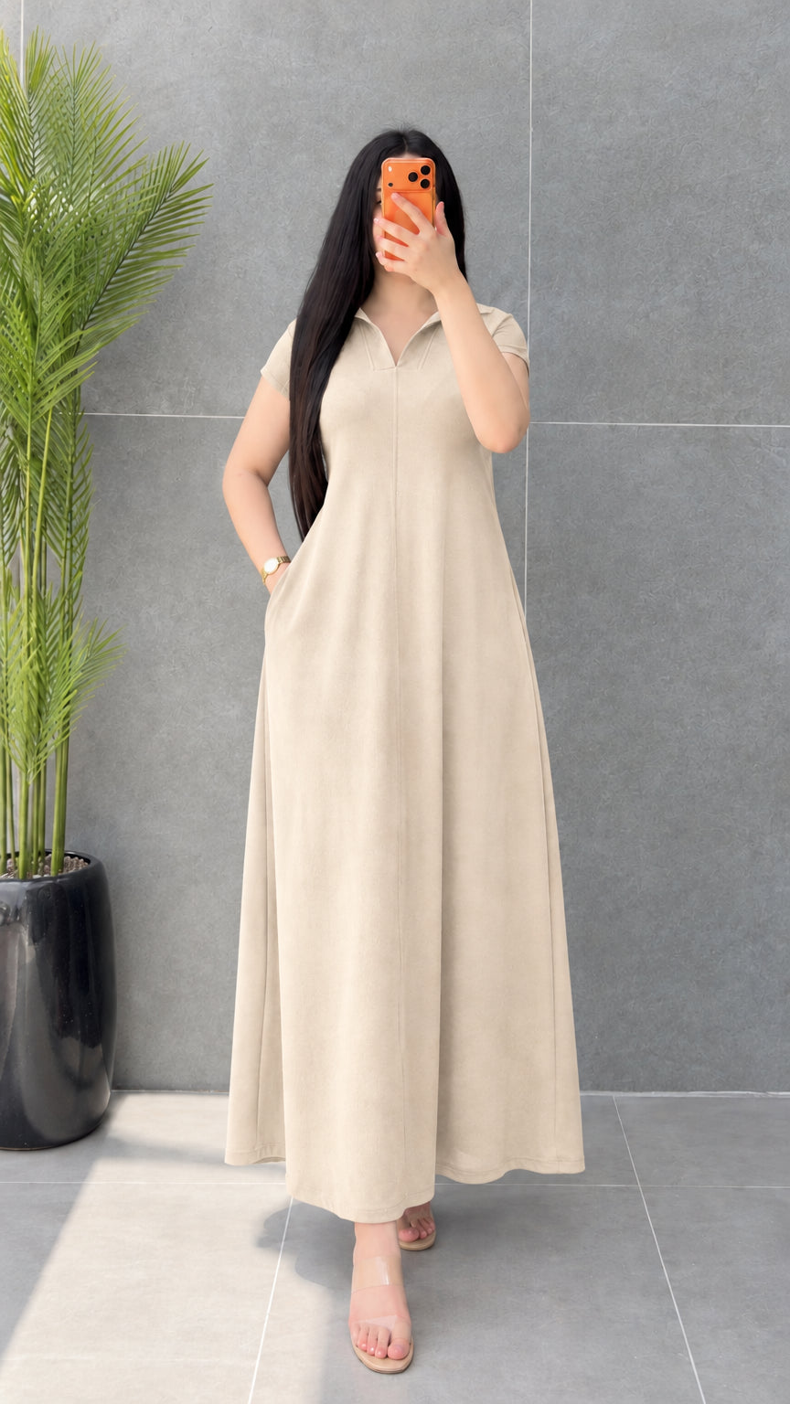 Front view of woman modeling neutral Beige short sleeve collared maxi dress